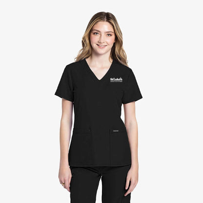 Person wearing a black scrub top with a logo on a white background