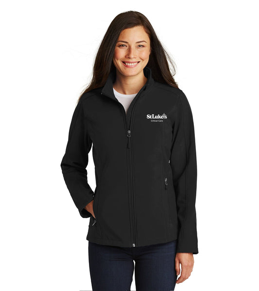 A woman wearing a black soft shell jacket with the hospital logo on the left chest area.